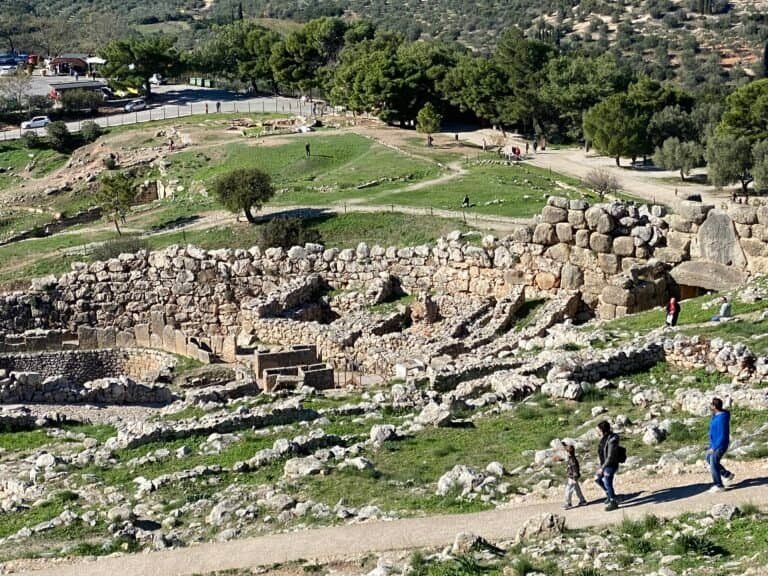 Ancient archaeological ruins with stone structures and pathways at Odyssey Academy.