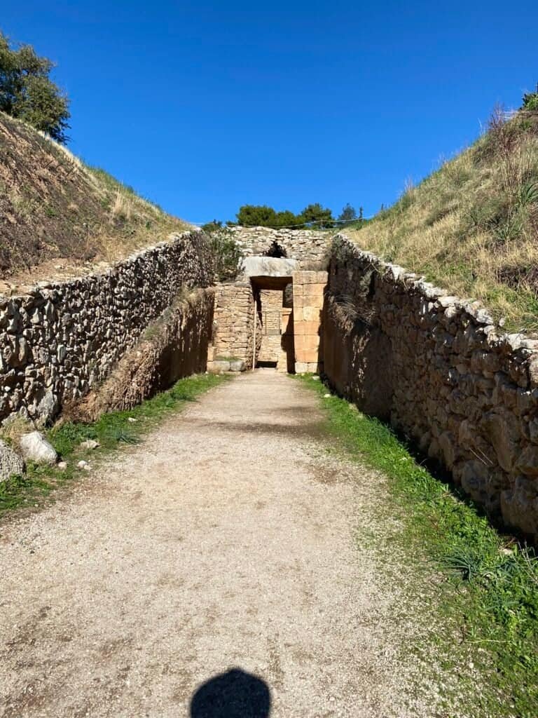 Archaeological site of ancient Mayan ruins at Odyssey Academy, with stone structures and pathways.
