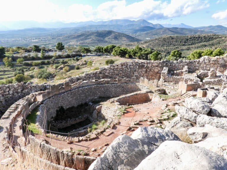 Ancient amphitheater ruins at Odyssey Academy, showcasing historical Greek architecture and archaeol.