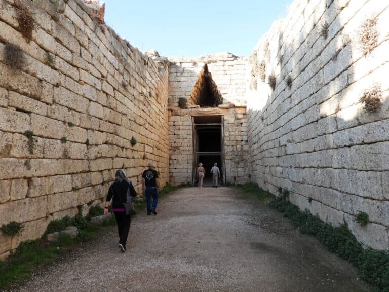 Ancient archaeological site at Odyssey Academy with visitors exploring historic ruins.