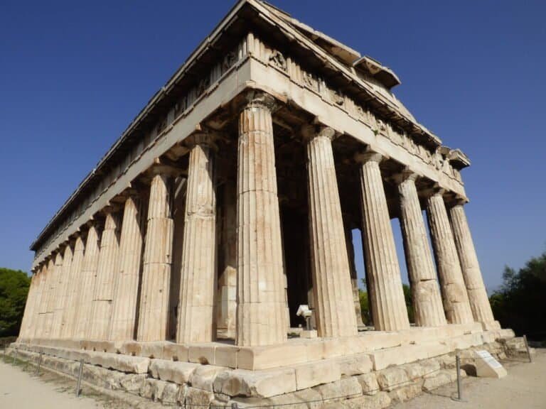 Ancient Greek temple with tall columns, part of Odyssey Academy's historical site.