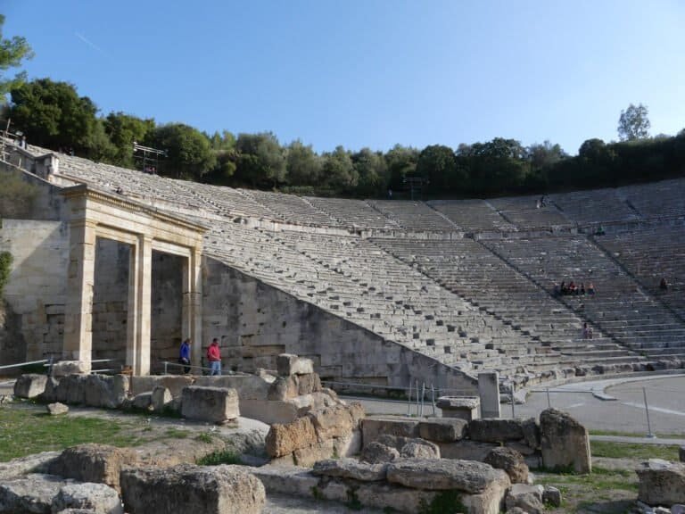 Historic Greek amphitheater with stone seating and stage at Odyssey Academy.
