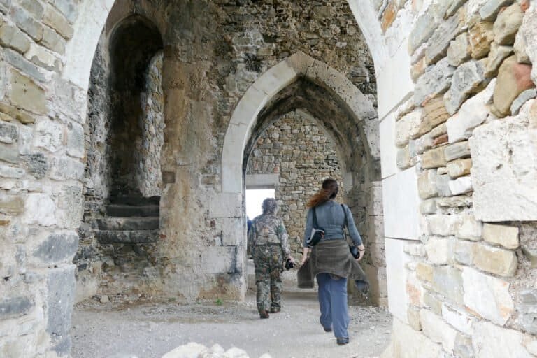 Ancient stone archway at Odyssey Academy, showcasing historical architecture and educational heritag.