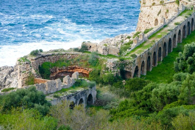 Ancient fortress ruins overlooking the sea, showcasing historical architecture and scenic coastal la.