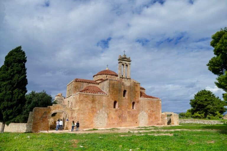 Ancient Byzantine church in Greece showcasing historic architecture and scenic landscape.