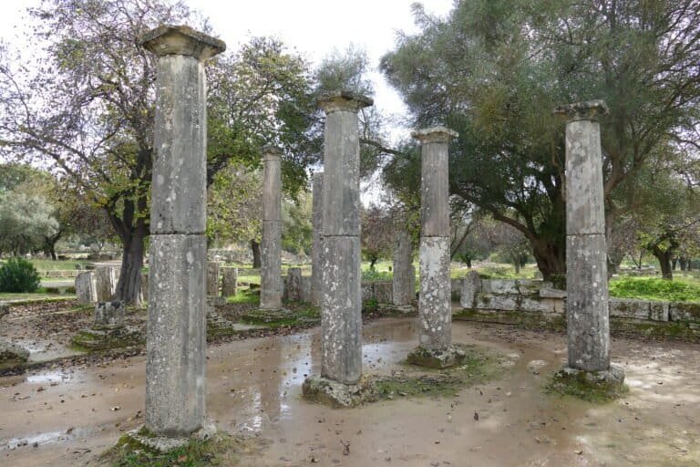 Ruins of ancient Roman columns at Odyssey Academy site in Greece.