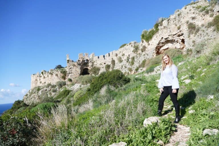 Outdoor exploration at Odyssey Academy with historic ruins in the background.