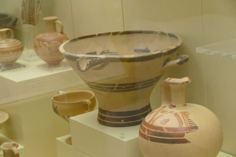 Ancient Greek pottery displayed in a museum exhibit, showcasing traditional designs and craftsmanshi.